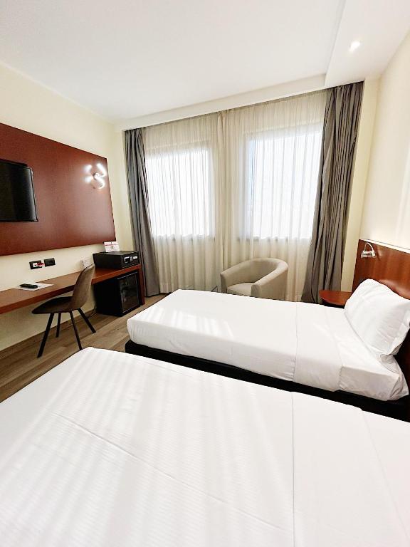 Łóżko lub łóżka w pokoju w obiekcie iH Hotels Milano Blu Visconti