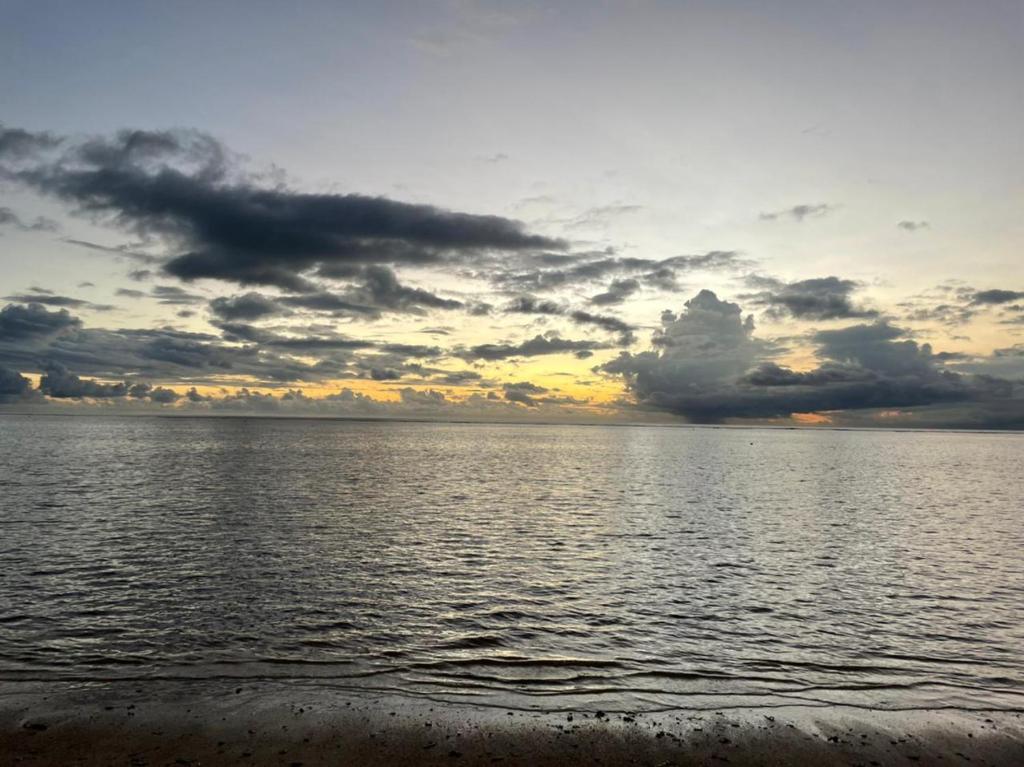 a sunset over a body of water at Ballito Sands in Ballito