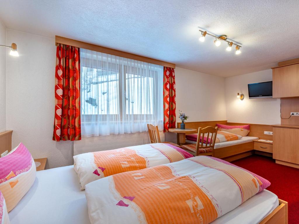 Posteľ alebo postele v izbe v ubytovaní Apartment Grissemann by Interhome