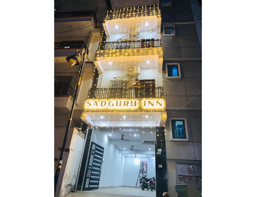 a building with a sign that reads saudiouk inn at Hotel Sadguru Inn, varanasi in Varanasi