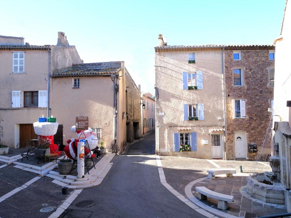 an empty street with buildings in a city at Apartment Domaine de Roquebrune by Interhome in La Rouviere