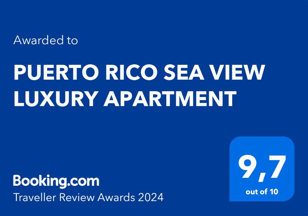 莫甘的住宿－PUERTO RICO SEA VIEW LUXURY APARTMENT，蓝色标志与文字普瑞科海景豪华公寓