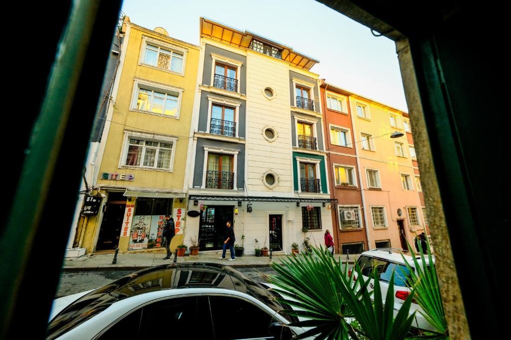 a view from a window of a street with buildings at step suites in Istanbul