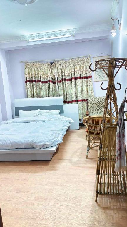Postel nebo postele na pokoji v ubytování Monkey Temple Homestay
