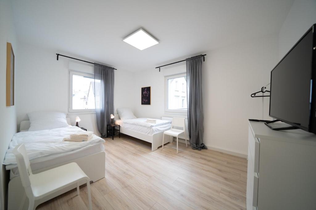 Säng eller sängar i ett rum på DWK: Monteurhaus Braubach bei Koblenz
