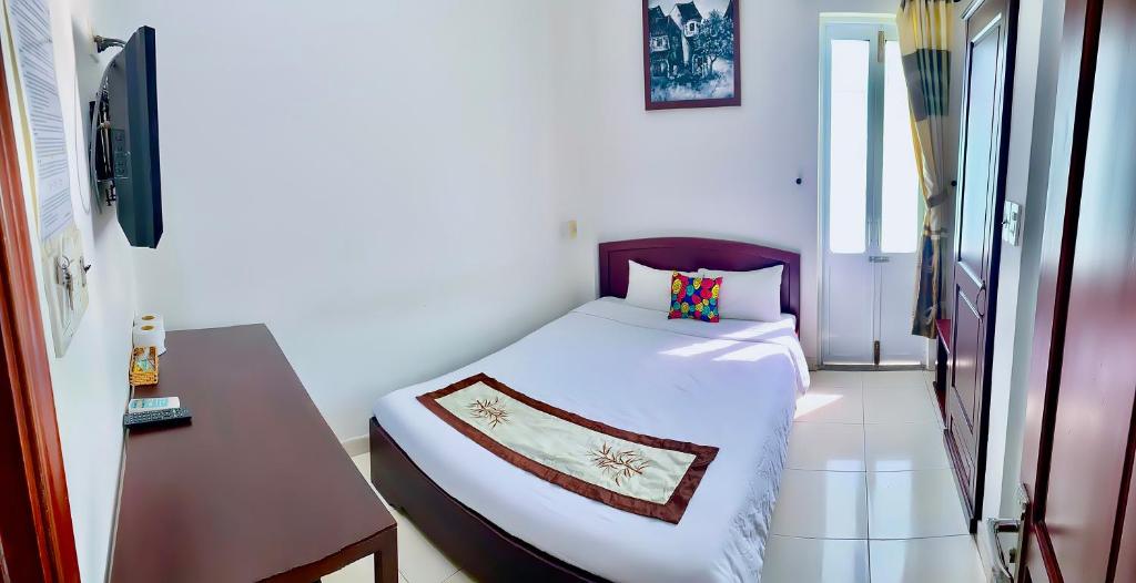 Postel nebo postele na pokoji v ubytování Hoian Old Town Hostel