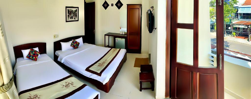 Postel nebo postele na pokoji v ubytování Hoian Old Town Hostel
