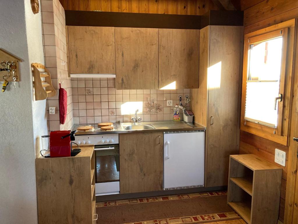 Kuchyň nebo kuchyňský kout v ubytování Chalet Alphütte
