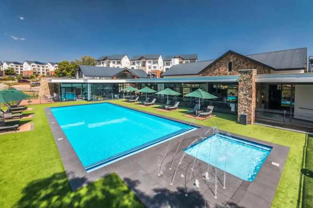 an image of a swimming pool at a resort at Lifestyle apartment in Sandton - Urban39 in Sandown