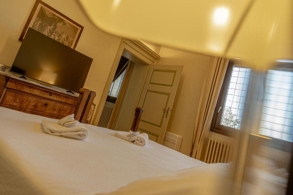 Postel nebo postele na pokoji v ubytování Il Castello Di San Gaudenzio