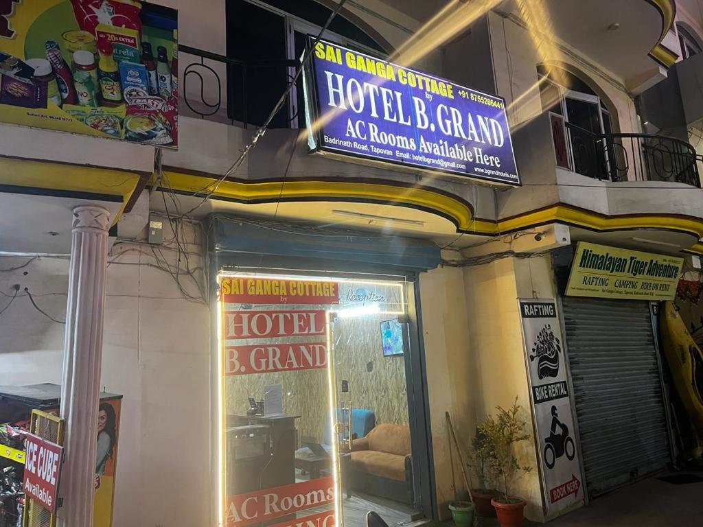 a store with a sign on the side of a building at Sai Ganga Cottage by B Grand in Rishīkesh