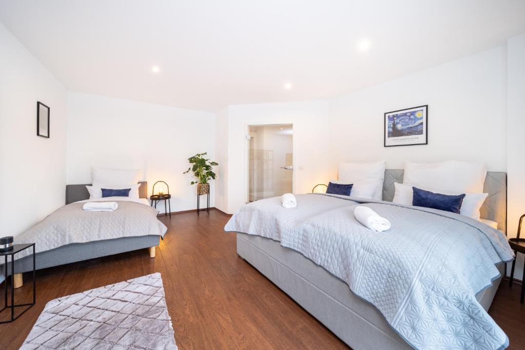 Postel nebo postele na pokoji v ubytování LaDolceVita - 100m2 Apartment in Zentraler Lage
