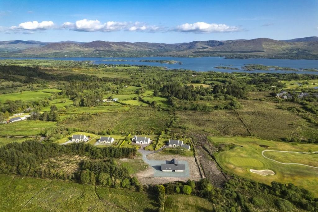 an aerial view of a large estate with a lake at Kenmare in Kenmare