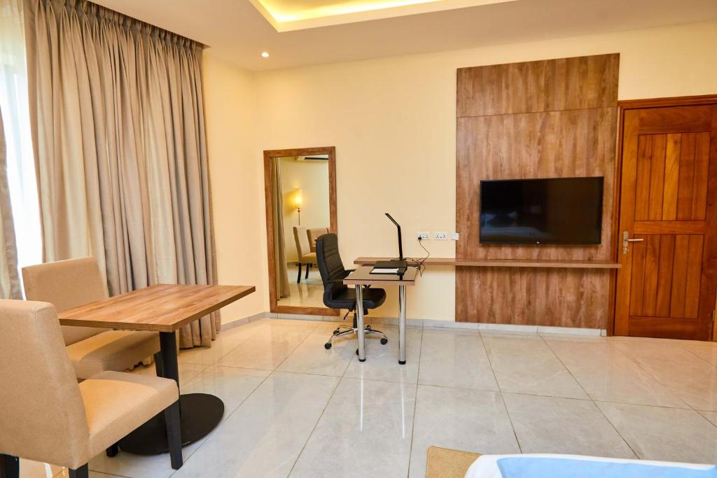 TV a/nebo společenská místnost v ubytování Vintano Hotel