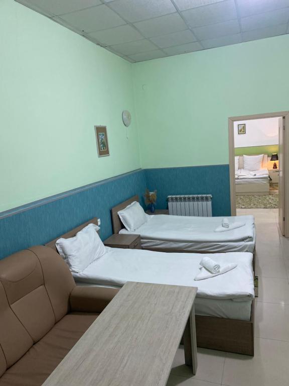 Postel nebo postele na pokoji v ubytování Lind Hotel and Guest House