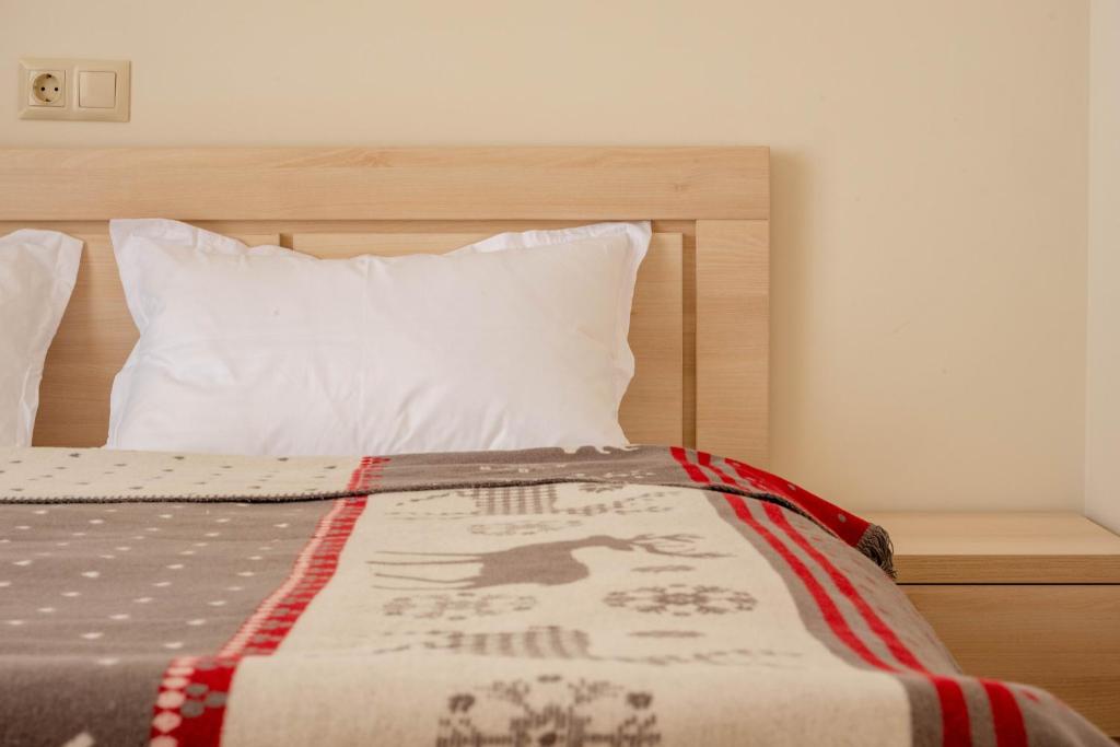 Postel nebo postele na pokoji v ubytování 2-room apartment New Gudauri F1