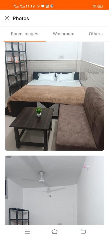 Faizābād的住宿－Blessing Home stay，一间卧室配有一张床、一张沙发和一张桌子