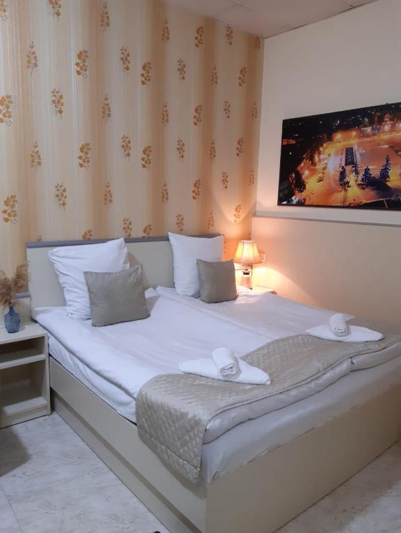 Postel nebo postele na pokoji v ubytování Lind Hotel and Guest House