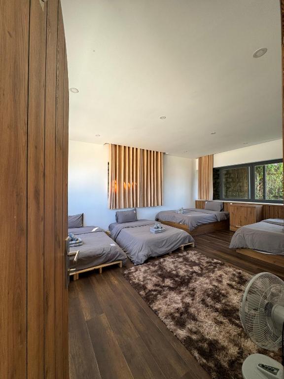 Postel nebo postele na pokoji v ubytování Nhà Sói Homestay Da Lat