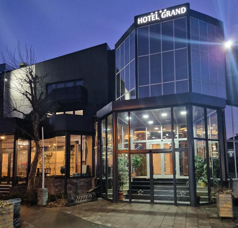 a building with a hotel brand sign on it at Hotel Grand in Banja Luka