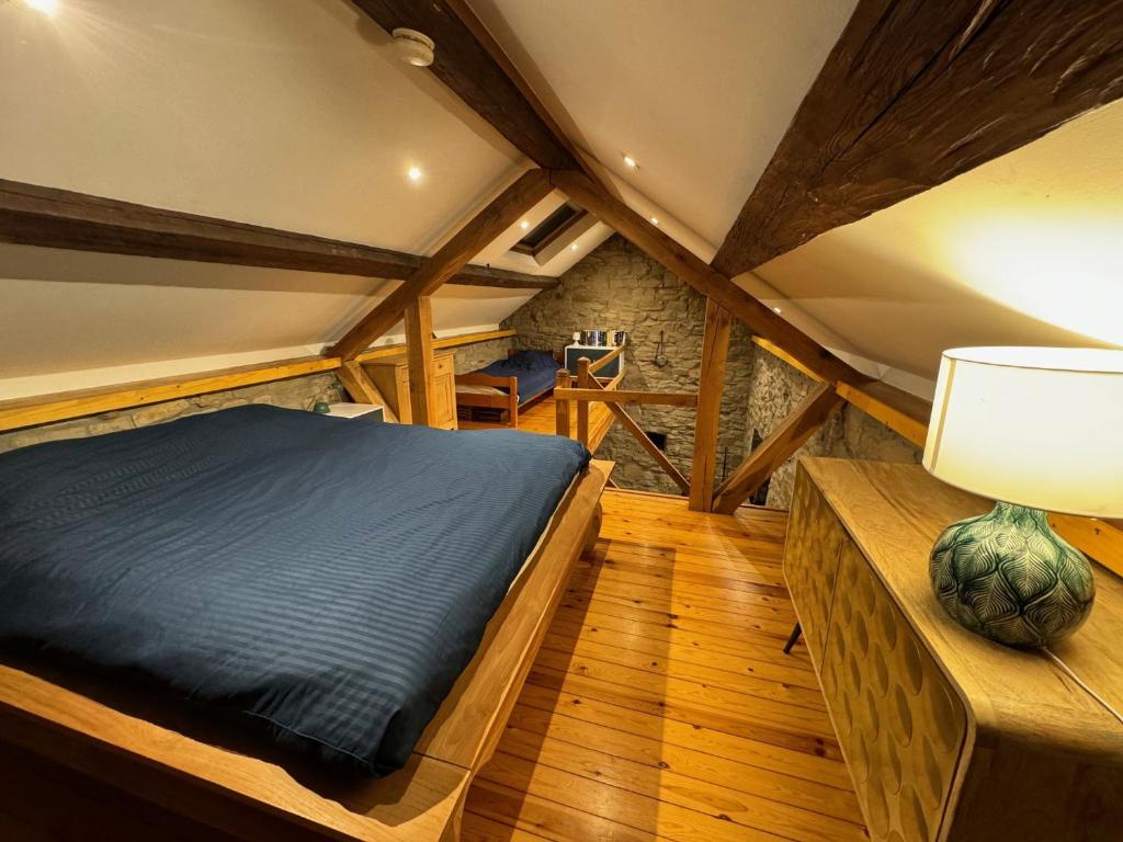 Postel nebo postele na pokoji v ubytování Gîte Le fournil