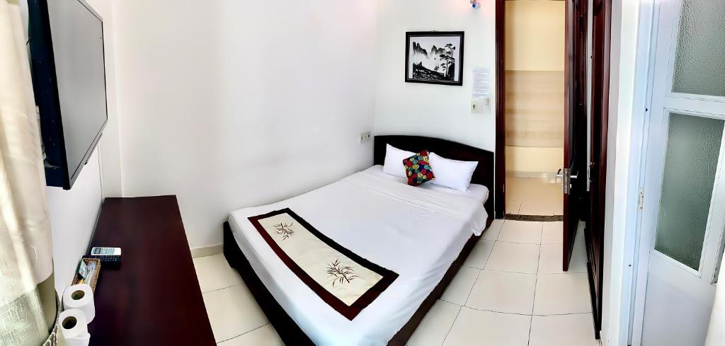 Postel nebo postele na pokoji v ubytování Hoian Old Town Hostel