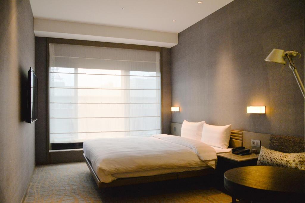Postel nebo postele na pokoji v ubytování Hotel Midtown Richardson