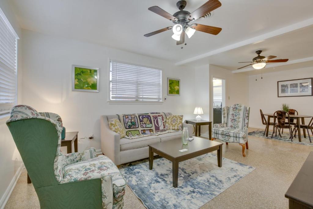 a living room with a couch and chairs and a table at New Orleans Area Home about 5 Mi to City Park! in Metairie