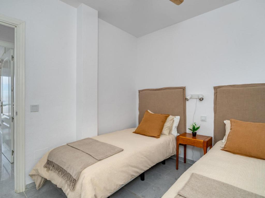 Postel nebo postele na pokoji v ubytování Apartment Ático Los Pelicanos by Interhome