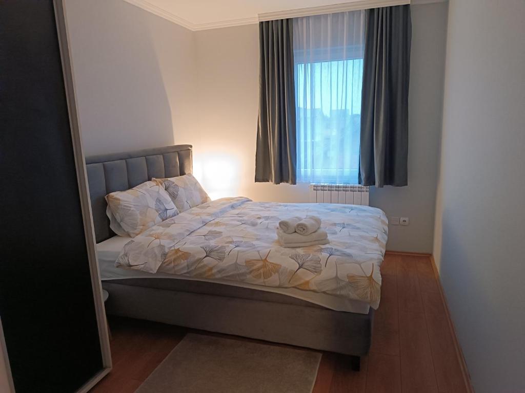 Postel nebo postele na pokoji v ubytování Apartman Mima