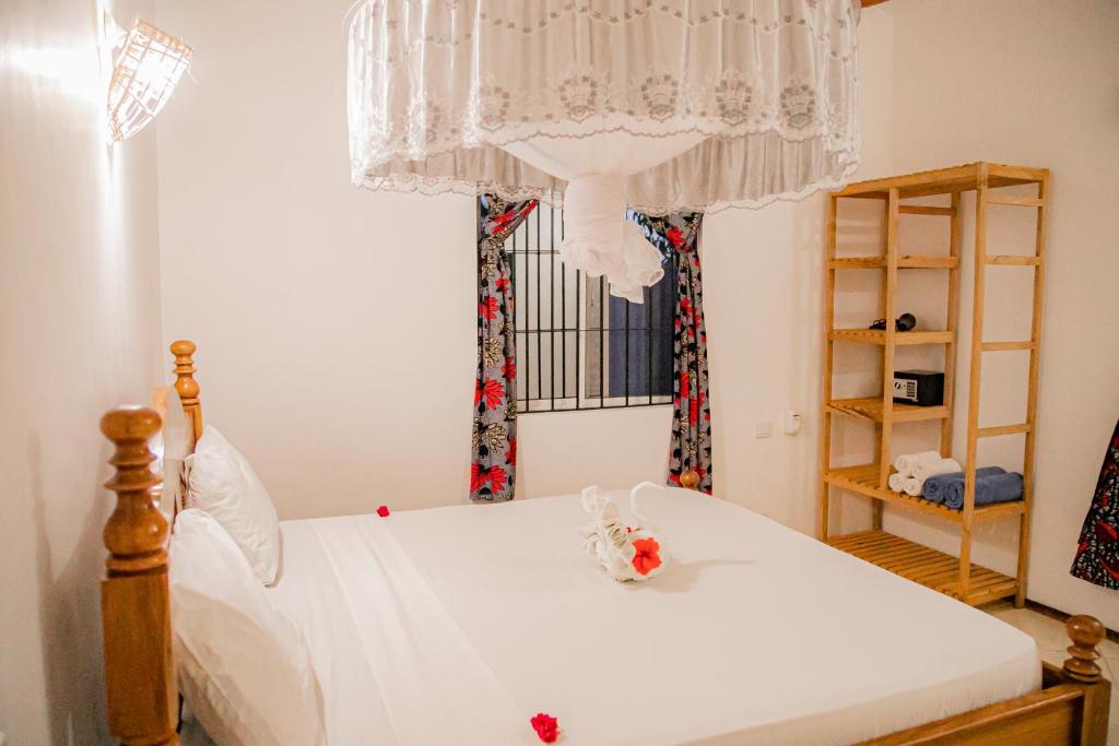 מיטה או מיטות בחדר ב-Villa Kikadini