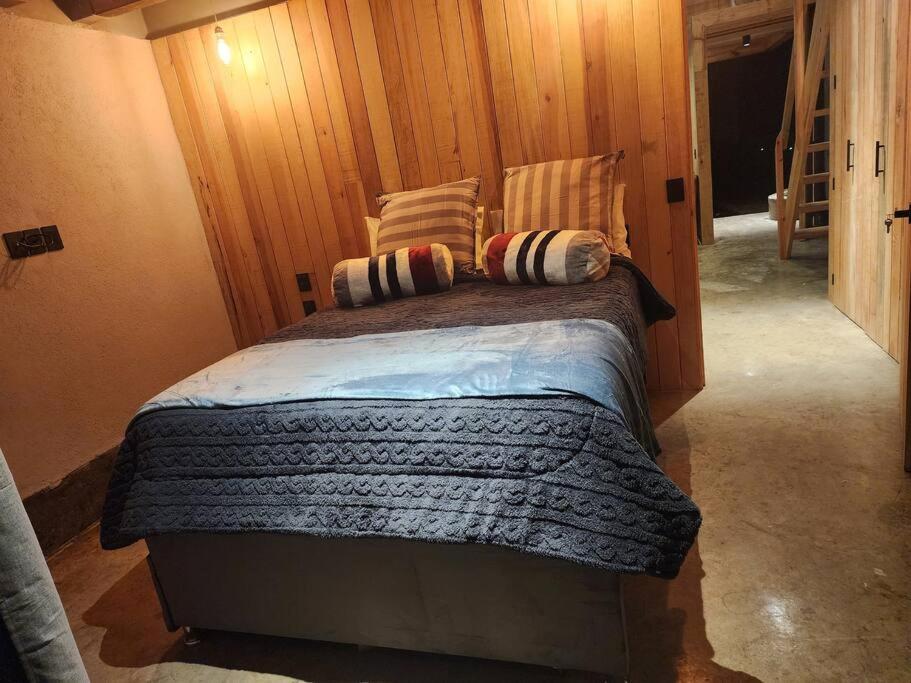 Postel nebo postele na pokoji v ubytování Le Petite Chalet Mazamitla