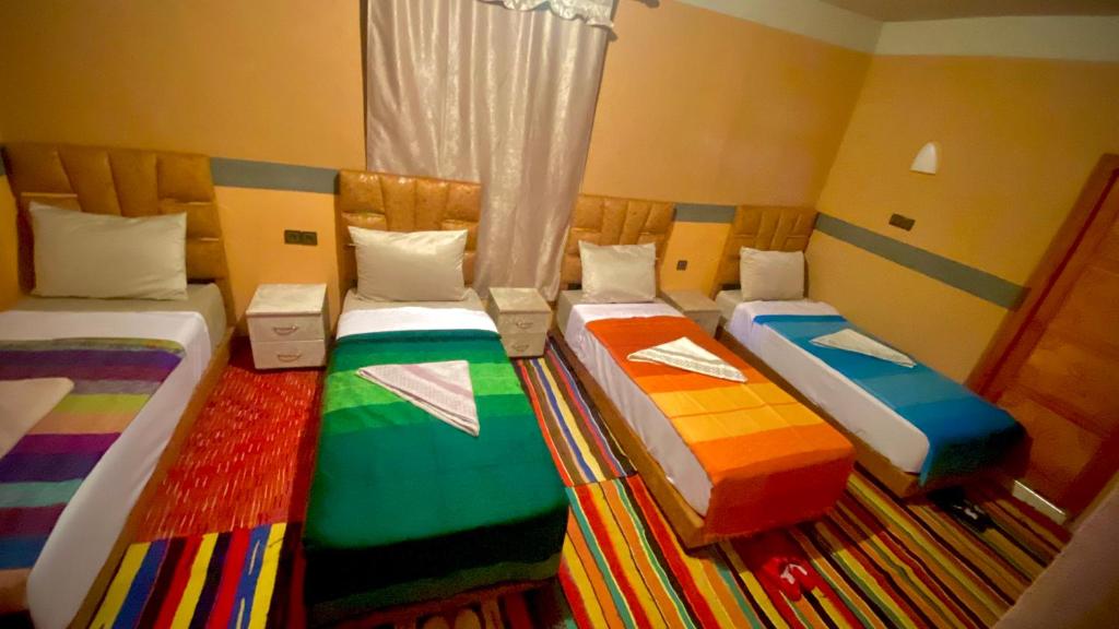Llit o llits en una habitació de Atlas Dar Chamonix