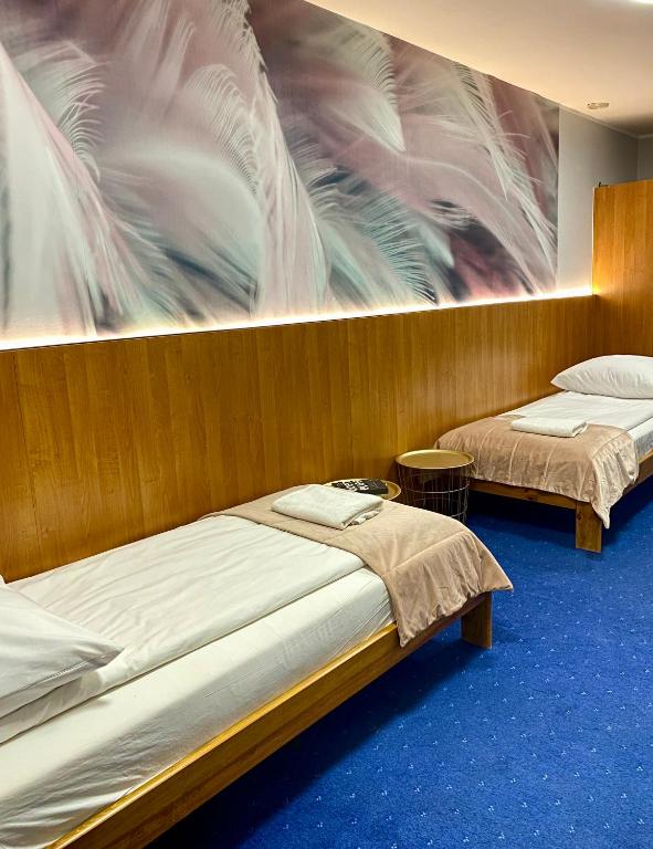 Postel nebo postele na pokoji v ubytování Garbarska 22 Aparthotel
