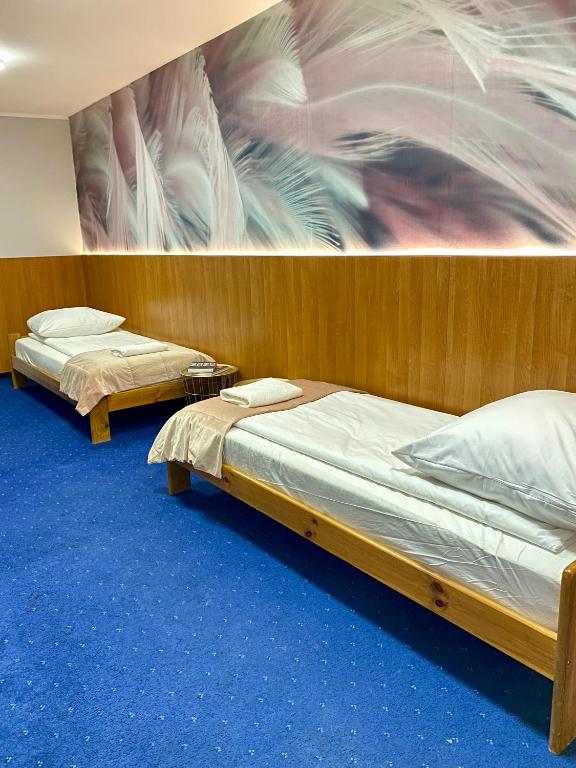 Postel nebo postele na pokoji v ubytování Garbarska 22 Aparthotel