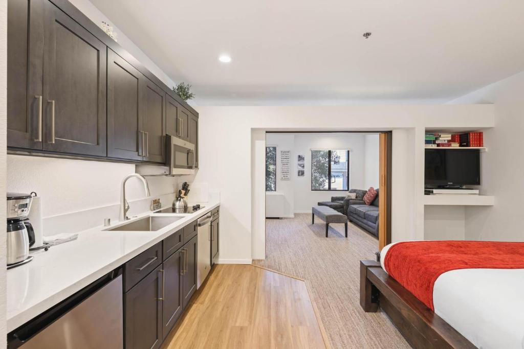 a kitchen and living room with a bed in a room at Palisades Tahoe Lodge Rentals Premium Studio #252 in Olympic Valley