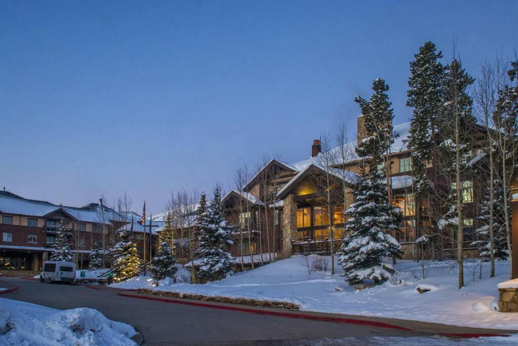 a home in the winter with snow on the ground at Grand Timber Lodge 3 bedroom - Ski-in/Ski-out in Breckenridge