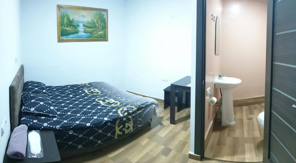 Postel nebo postele na pokoji v ubytování Hotel Amigo