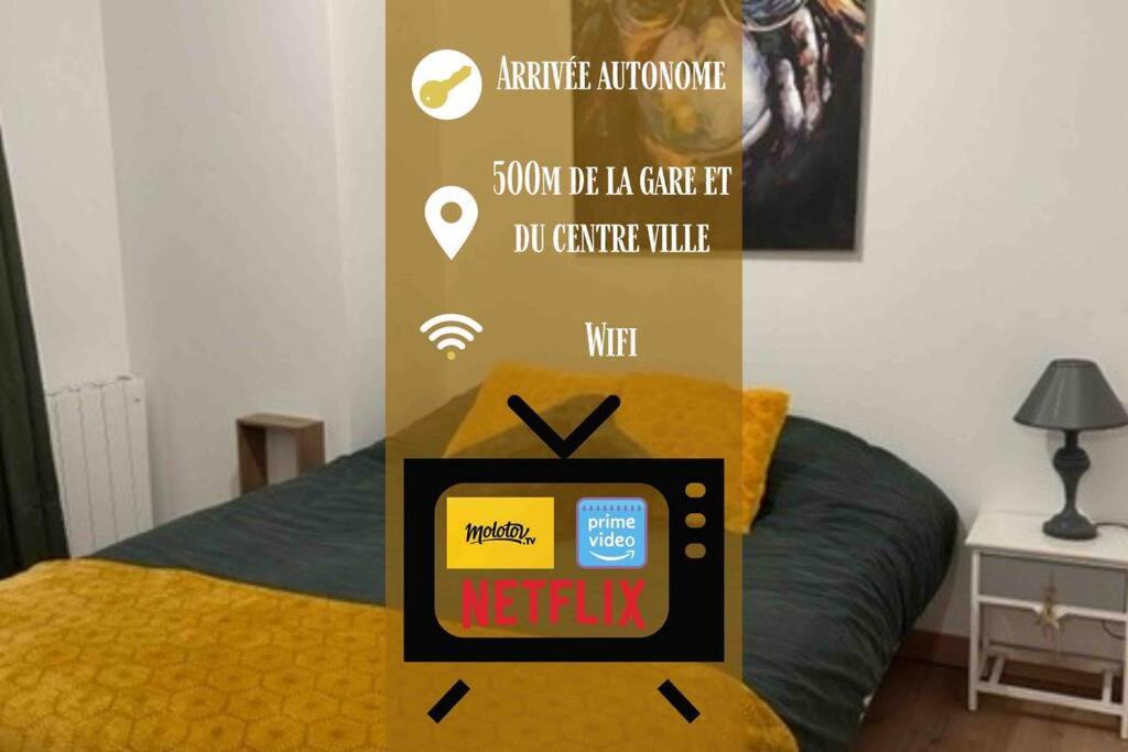 a poster of a bed with a tv on it at Appart 500 m centre ville - gare in Soissons
