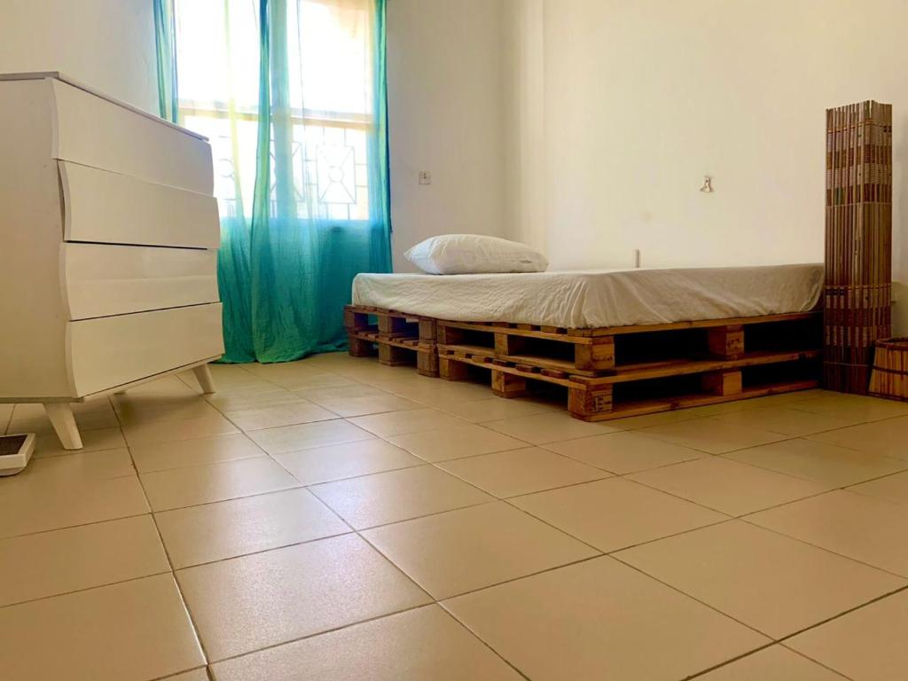 Vuode tai vuoteita majoituspaikassa Appartement à la Zone du Bois