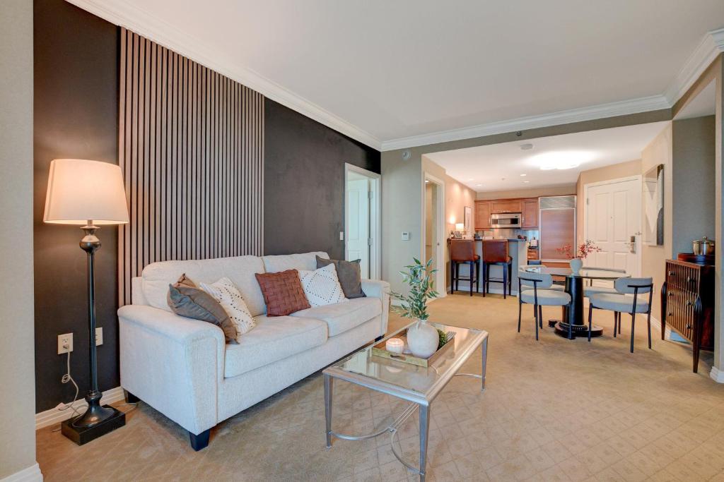 a living room with a couch and a table at MGM Finest 1BD 2BTH with Balcony Free access to Lazy River Pool in Las Vegas