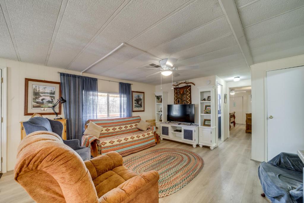 a living room with a couch and a tv at Near Hiking and Wineries Charming Camp Verde Home! in Camp Verde