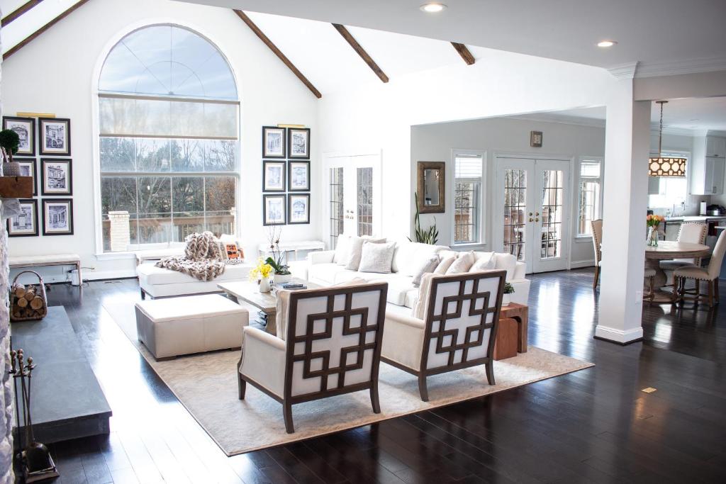 a living room with a white couch and chairs at Hygge, Upscale & Relaxing Luxury in Potomac