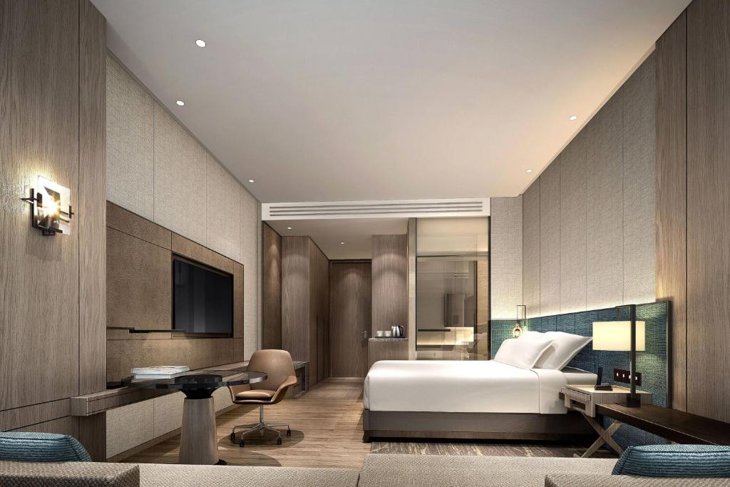 Postel nebo postele na pokoji v ubytování Courtyard by Marriott Shenzhen Bay