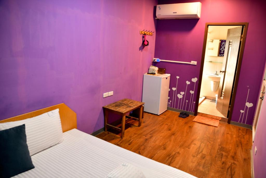 Postel nebo postele na pokoji v ubytování Ye Yuan Star Homestay