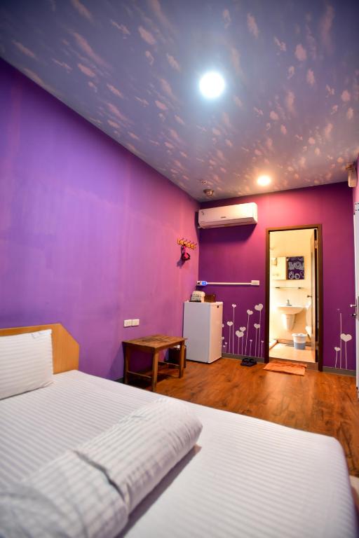 Postel nebo postele na pokoji v ubytování Ye Yuan Star Homestay