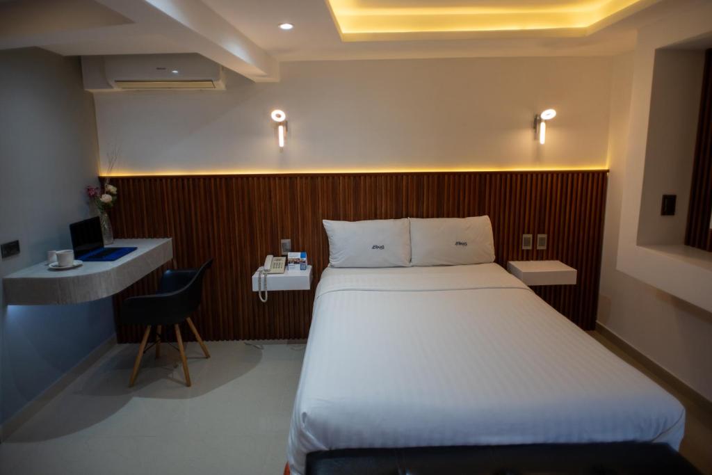 Postel nebo postele na pokoji v ubytování Hotel Atenas