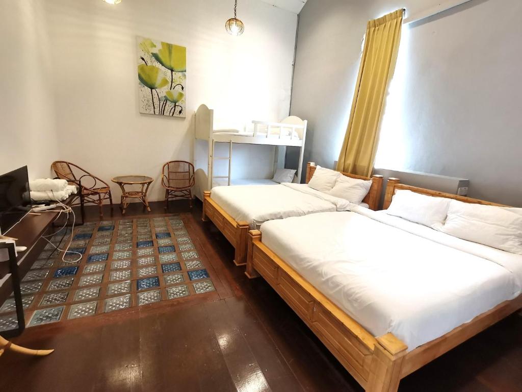 Postel nebo postele na pokoji v ubytování Mori Jonker Homestay
