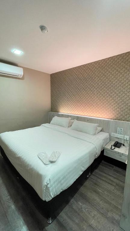 Postel nebo postele na pokoji v ubytování De Parkview Hotel