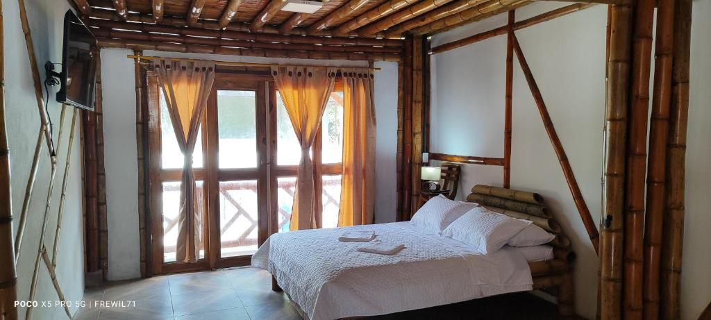 Ένα ή περισσότερα κρεβάτια σε δωμάτιο στο Villa Ester Hostel Vereda Cay